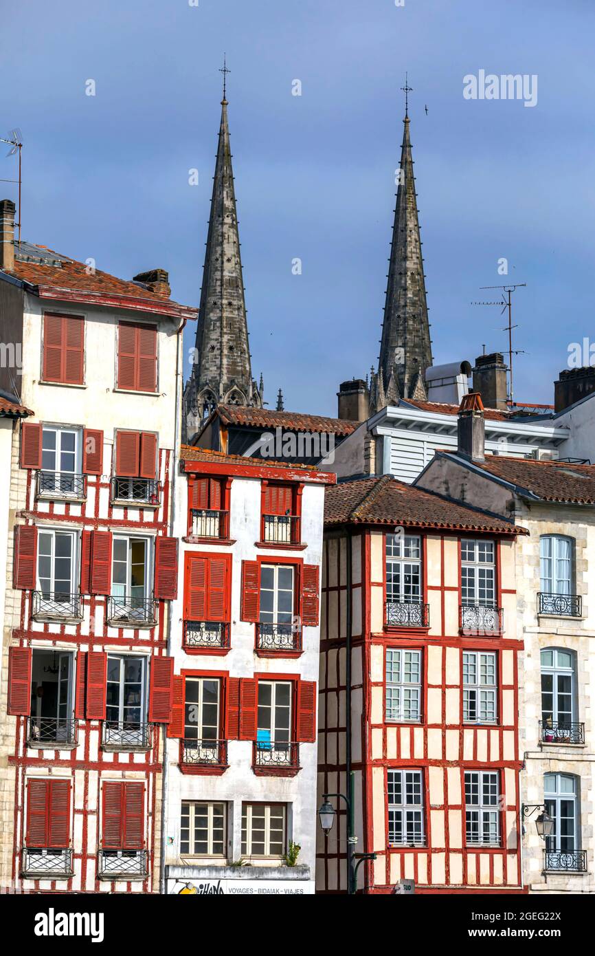 Bayonne (south western France): facades of old buildings and half timbered houses on the banks of the Adour river and spires of St. Mary's Cathedral ( Stock Photo