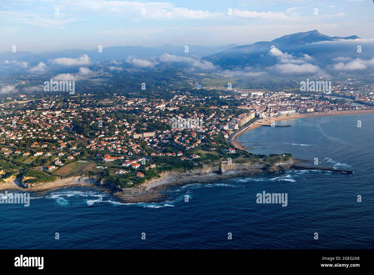 Saint Jean de Luz (south western France): aerial view of the Basque coast with the town, the cliffs, the beach and mountains in the distance Stock Photo