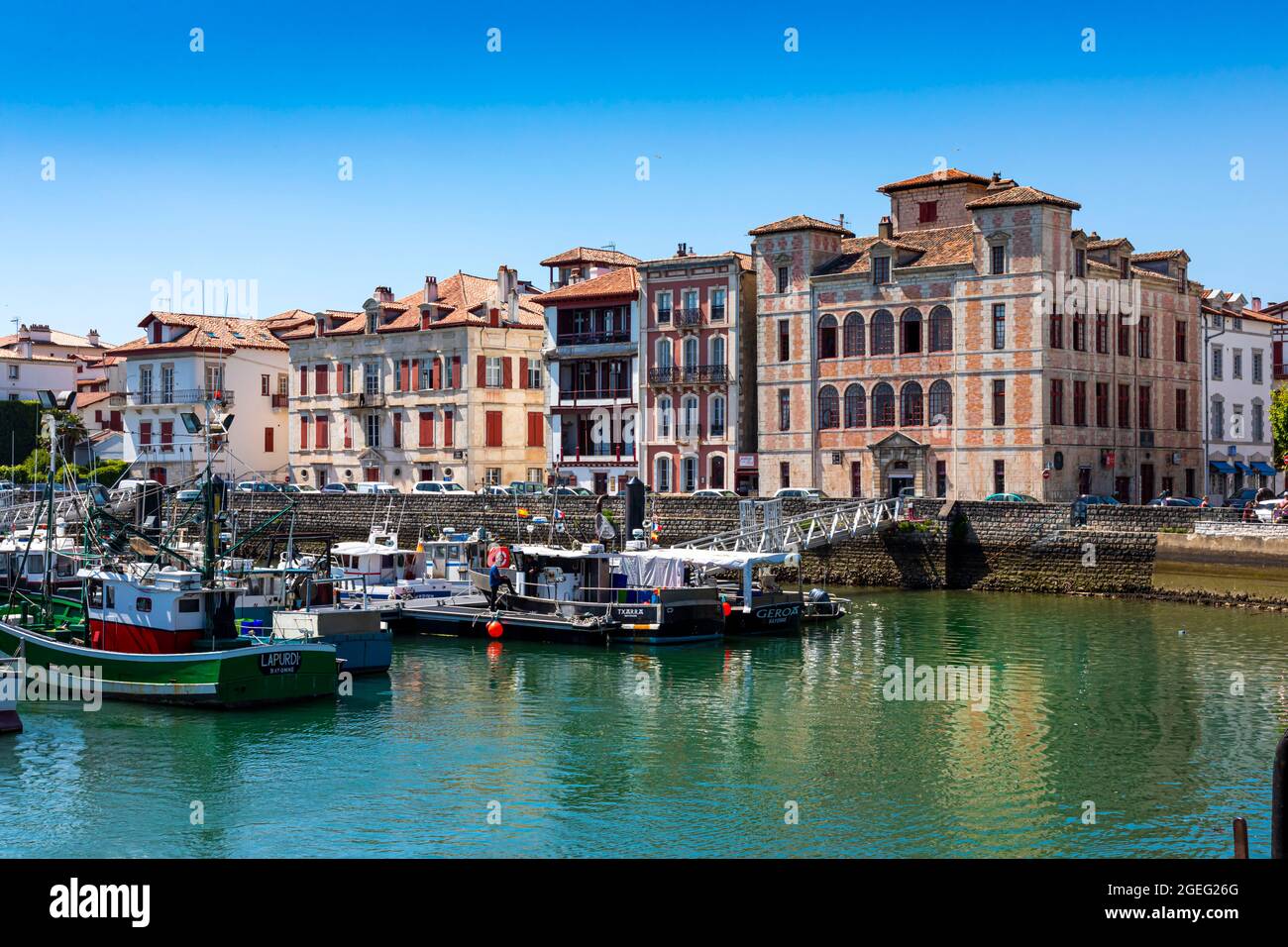 Saint Jean de Luz (south western France): overview of the fishing port, the town and the House of the Infante Stock Photo