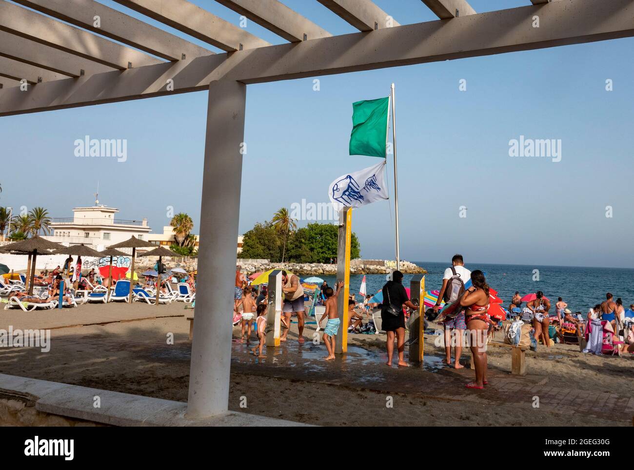 pic shows: Warning flags of  jellyfish on the beach on the Costa Del Sol  Brits sizzle in scorching temperatures in Fuengirola Spain   But there were Stock Photo