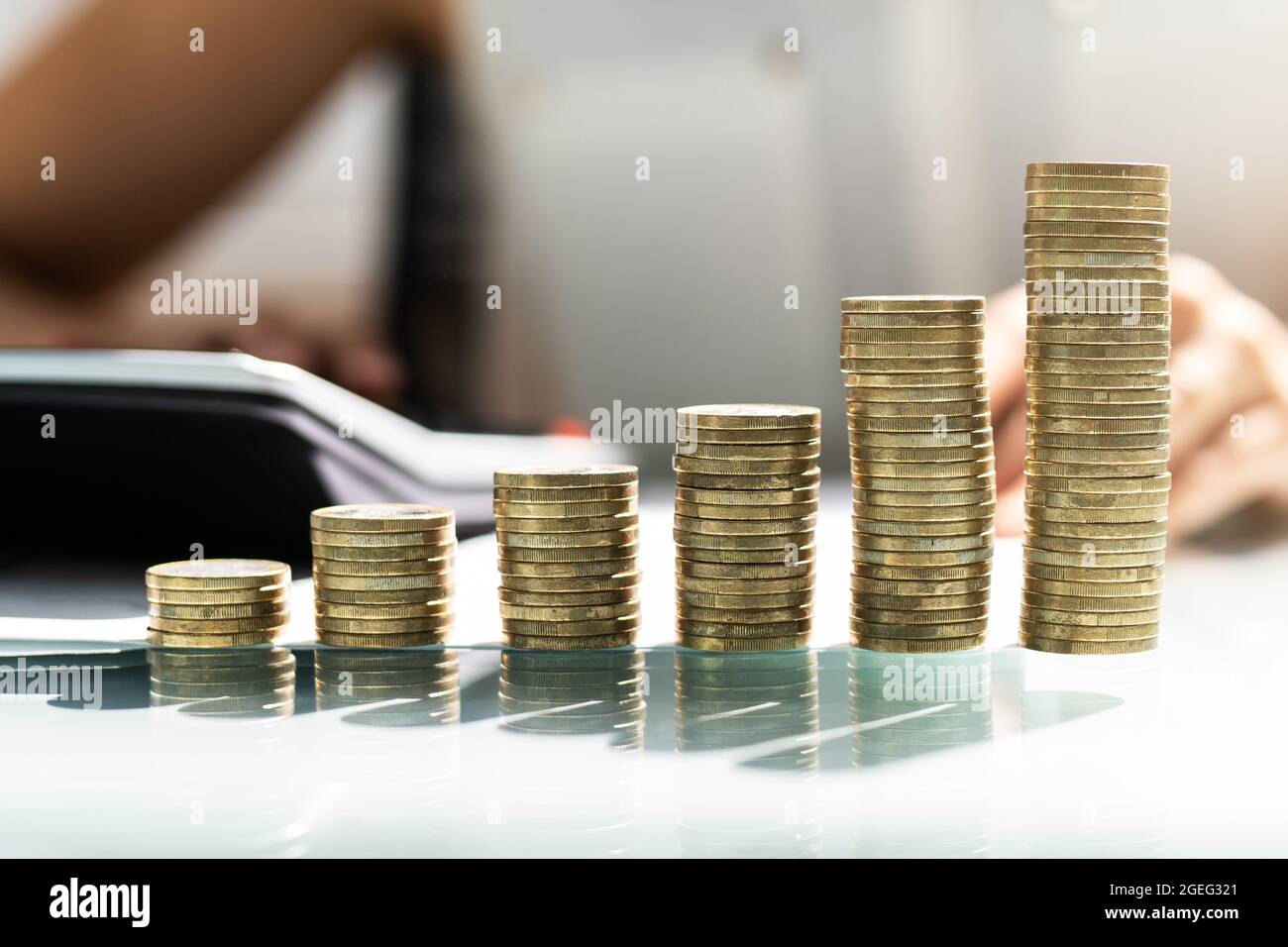 Paying Income Tax. Money And Finance. Coin Stack Stock Photo - Alamy