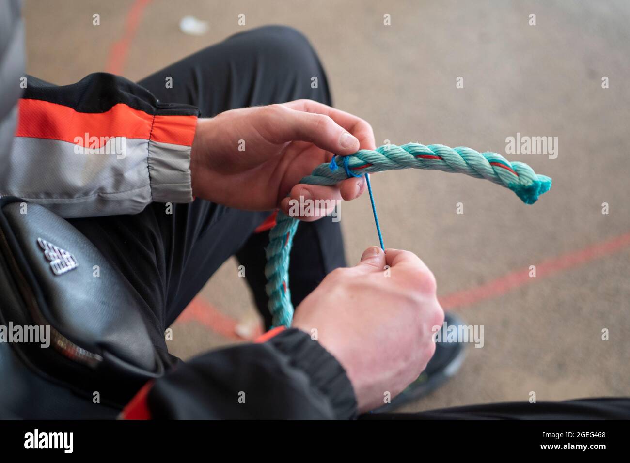 Technical college “Lycee Pierre Loti” in Paimpol (Brittany, north western France): mending of fishing nets and marlinespike seamanship, students in a Stock Photo