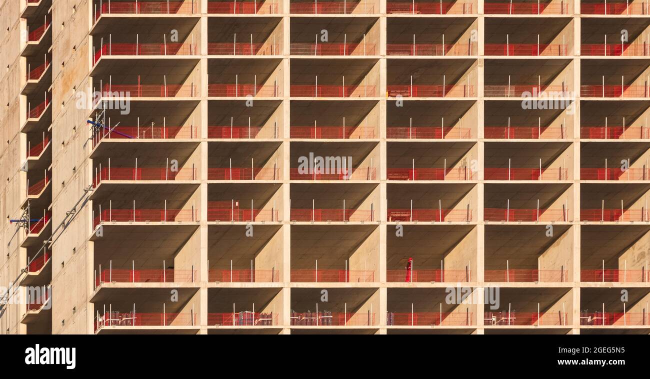Repeating pattern of a residential skyscraper under construction in ...