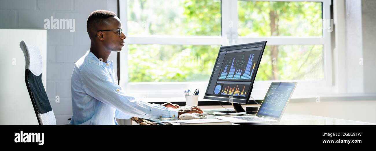African Advisor Using KPI Dashboard With Financial Analytics Graphs Stock Photo