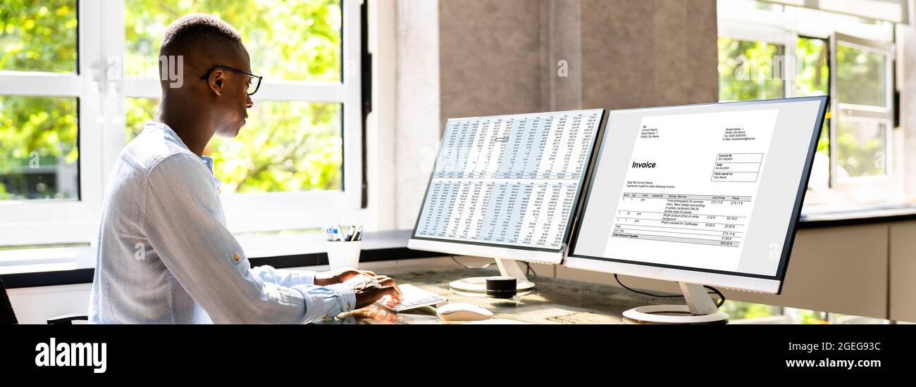 Tax Account Invoice Spreadsheet Report On Computer Monitor Stock Photo