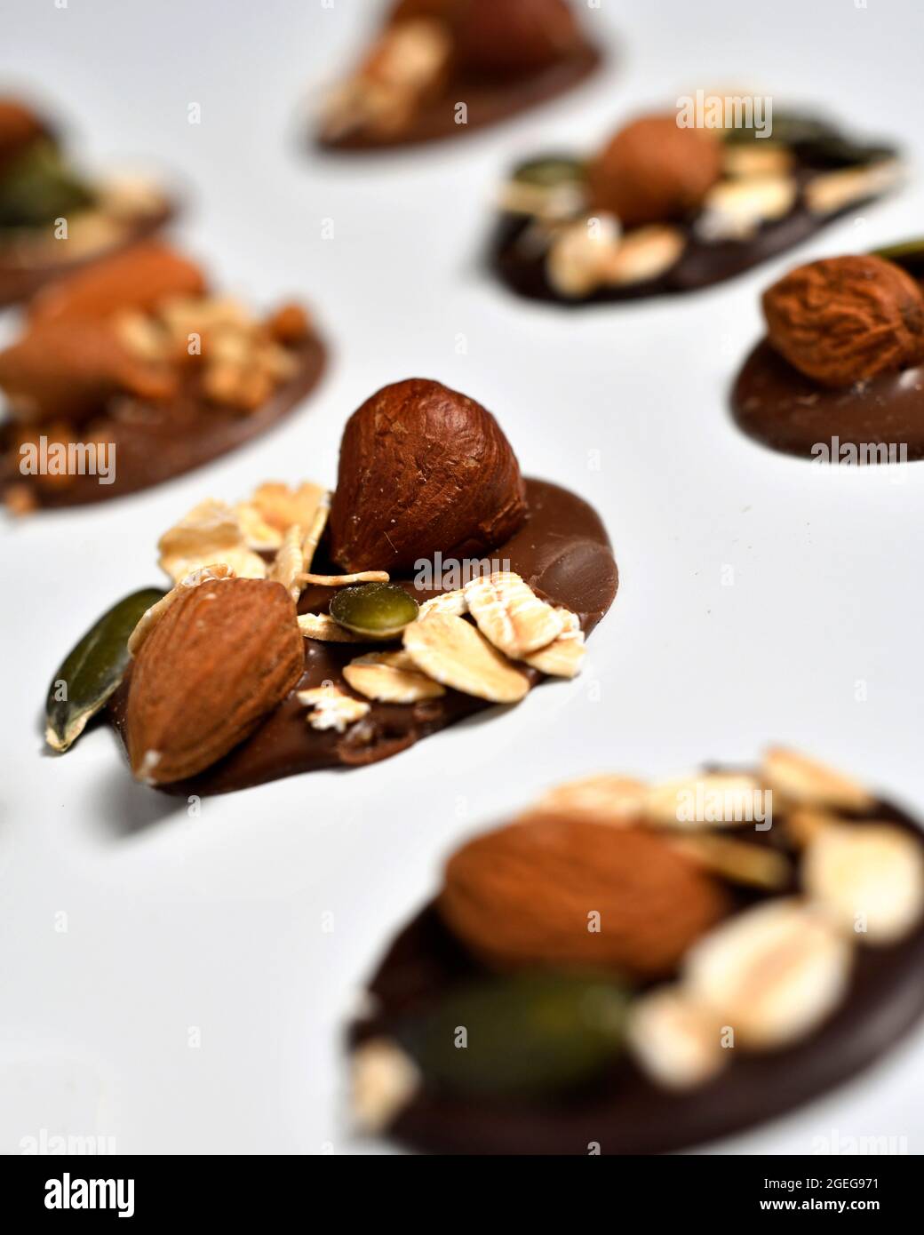 Mendiants, traditional French confections composed of a chocolate disk studded with nuts and dried fruits representing the four mendicant or monastic Stock Photo