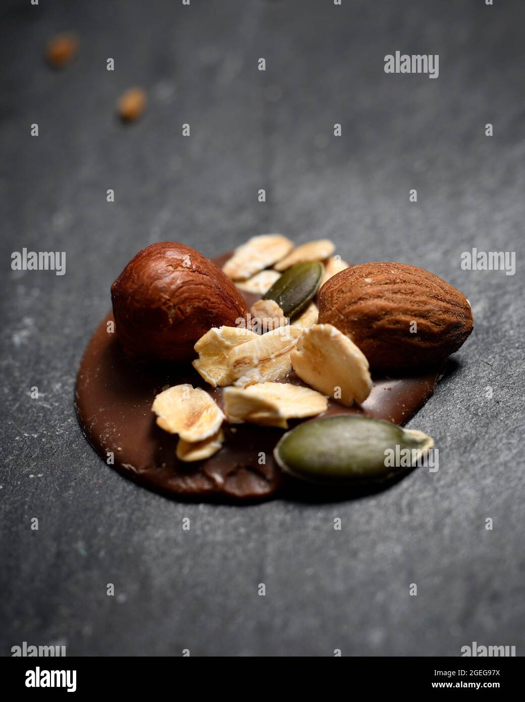 Mendiants, traditional French confections composed of a chocolate disk studded with nuts and dried fruits representing the four mendicant or monastic Stock Photo