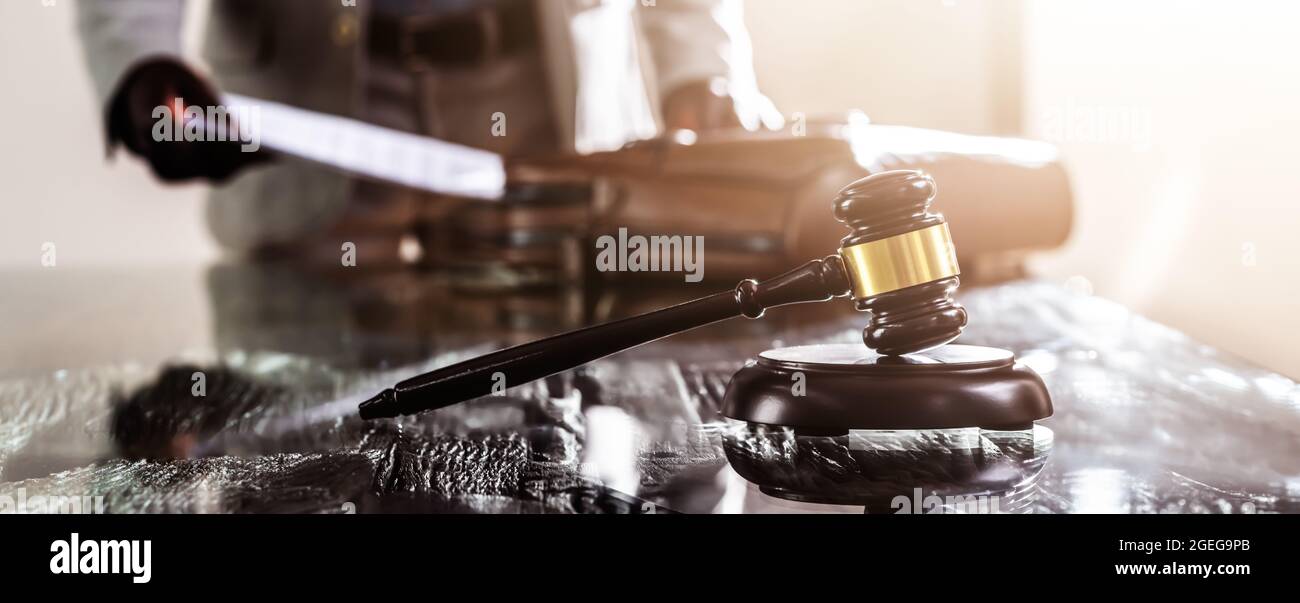 Lawyer Working On Trial In Courtroom. Briefcase With Documents Stock