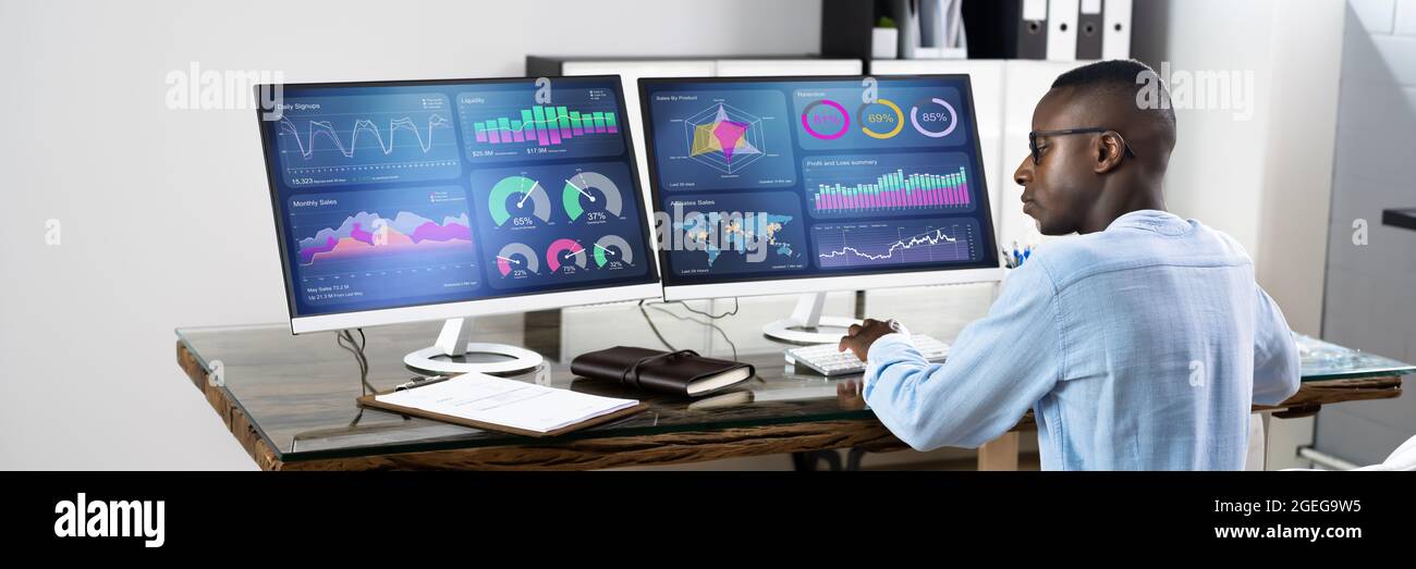 African Advisor Using KPI Dashboard With Financial Analytics Graphs Stock Photo