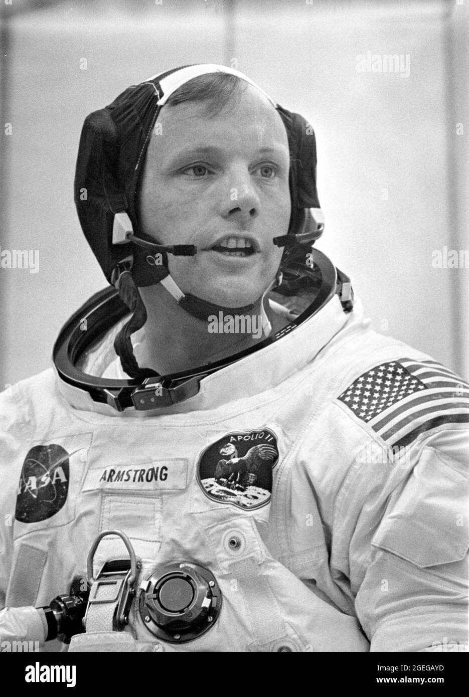 Dunned in his space suit, mission commander Neil A. Armstrong does a final check of his communications system before before the boarding of the Apollo 11 mission. Launched via a Saturn V launch vehicle, the first manned lunar mission launched from the Kennedy Space Center, Florida on July 16, 1969 and safely returned to Earth on July 24, 1969. The Saturn V vehicle was developed by the Marshall Space Flight Center (MSFC) under the direction of Dr. Wernher von Braun. The 3-man crew aboard the flight consisted of astronauts Armstrong; Michael Collins, Command Module (CM) pilot; and Edwin E. Aldri Stock Photo