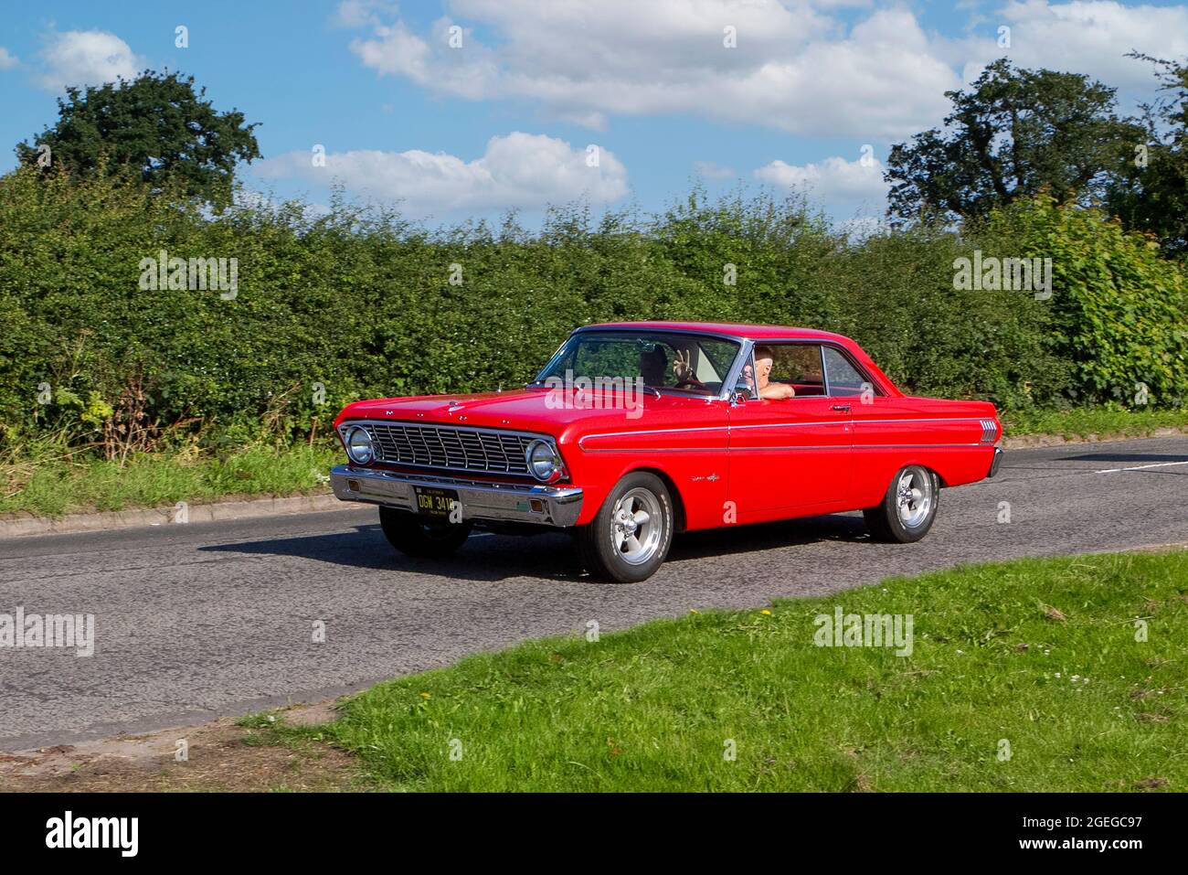 A front view of a red 1960s 60s FORD FALCON SPRINT PETROL vintage classic car retro driver vehicle automobile Stock Photo