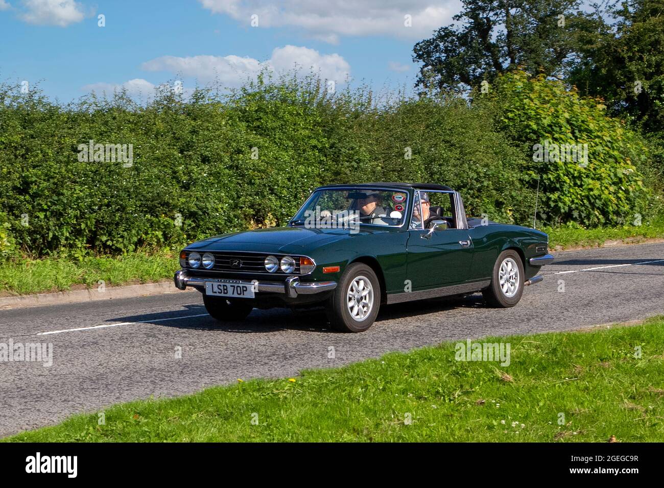 A front view of 1976 1970s 70s Petrol Green Triumph Stag vintage classic car retro driver vehicle automobile Stock Photo