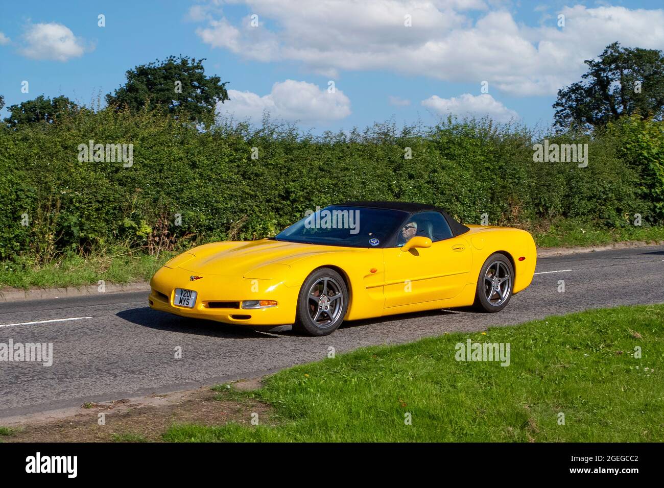 A front view of Yellow Chevrolet Gmc Corvette Roadster vintage classic car retro driver vehicle automobile Stock Photo