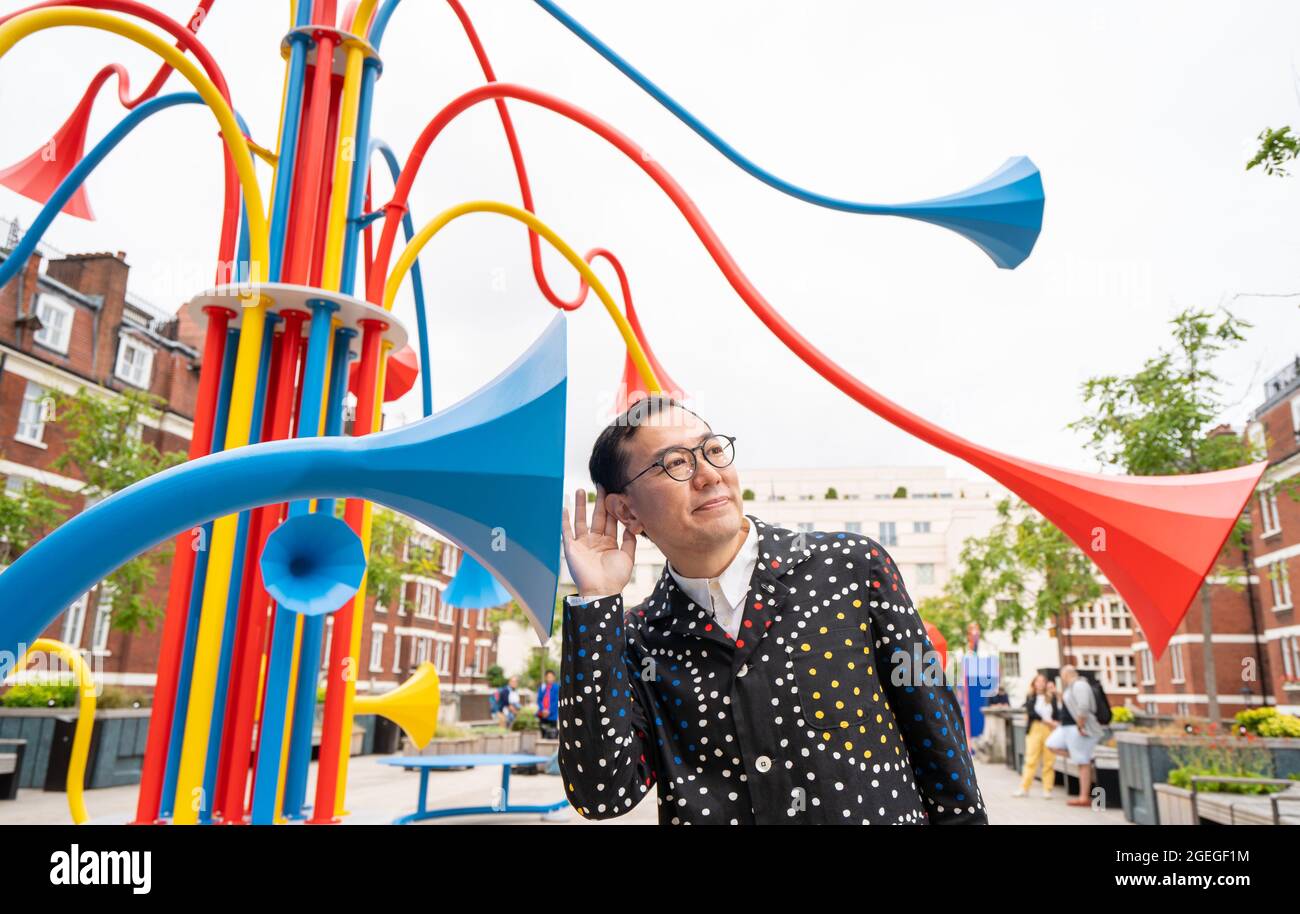 Artist Yuri Suzuki with his sculpture Sonic Bloom at Brown Hart Gardens in Mayfair, London. Picture date: Friday August 20, 2021. Stock Photo