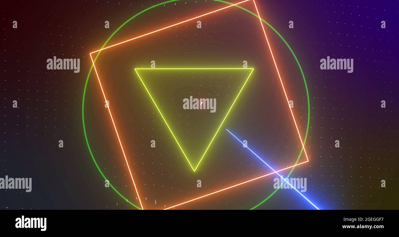 Image of rotating yellow, orange, green neon shapes with pink and blue lasers, on black Stock Photo