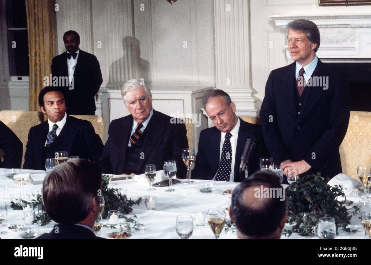 United States President Jimmy Carter, right, offers remarks at a working dinner in honor of Prime Minister Yitzhak Rabin of Israel, right center, in the State Dining Room of the White House in Washington, DC on Monday, March 7, 1977. Looking on is Speaker of the US House of Representatives Tip O'Neill (Democrat of Massachusetts), left center, and US Ambassador to the United Nations Andrew Young.Credit: Benjamin E. 'Gene' Forte/CNP/Sipa USA Credit: Sipa USA/Alamy Live News Stock Photo