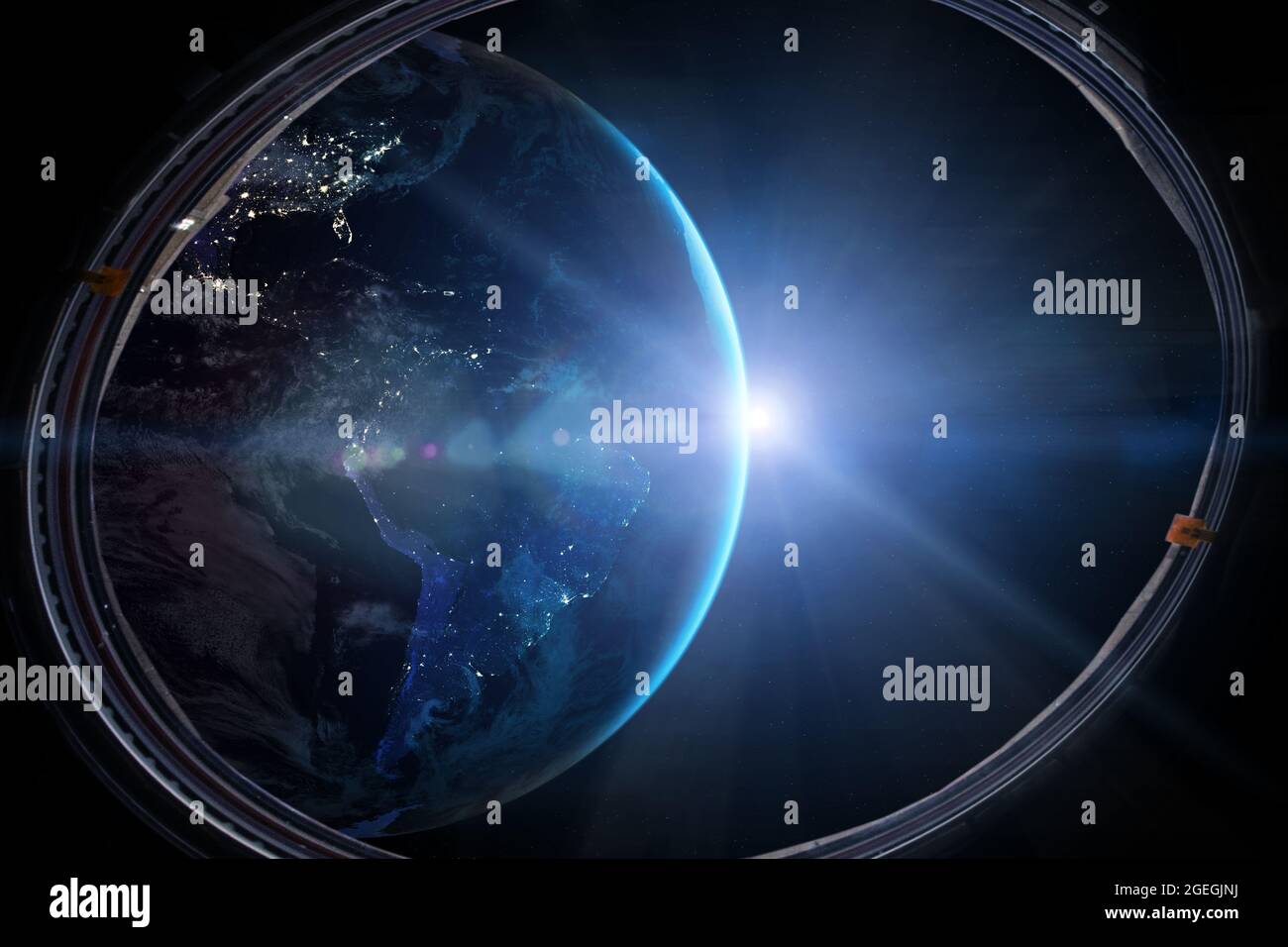 View from a porthole of space station on the Earth background. Elements of this image furnished by NASA. Stock Photo