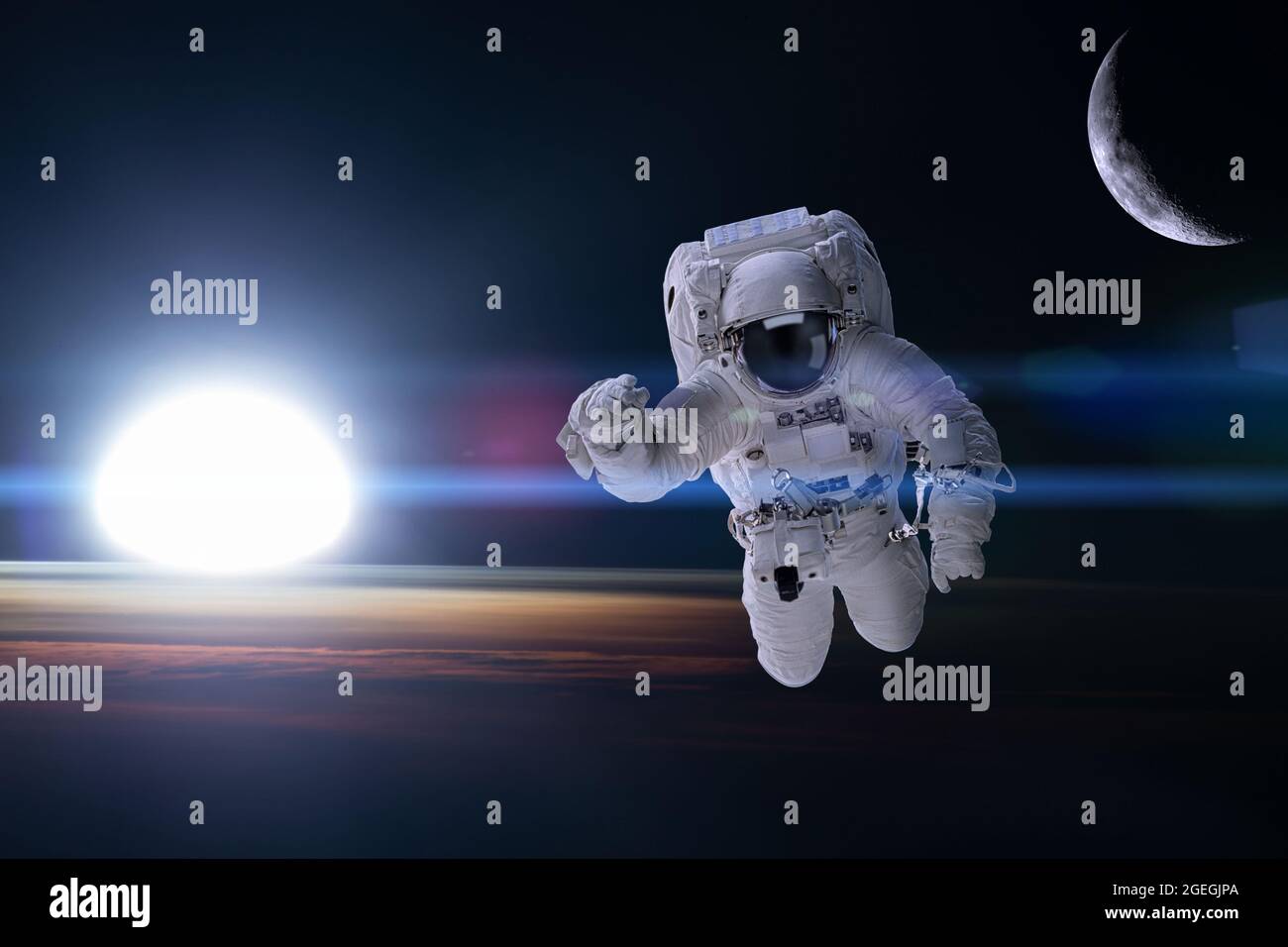 Astronaut in outer space on background of the night Earth. Elements of this image furnished by NASA. Stock Photo