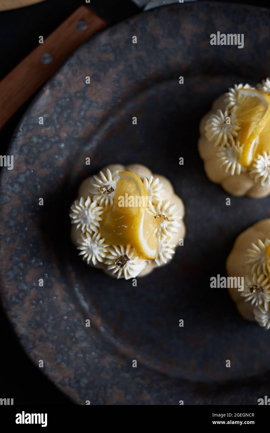 mini lemon bundt cakes topped with lemon Stock Photo