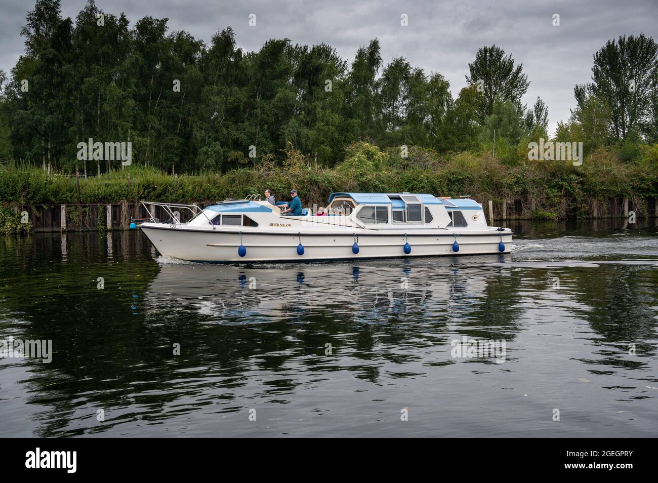 Cruising on the River Yare. Holiday on the Norfolk Broads with a Hired boat Stock Photo