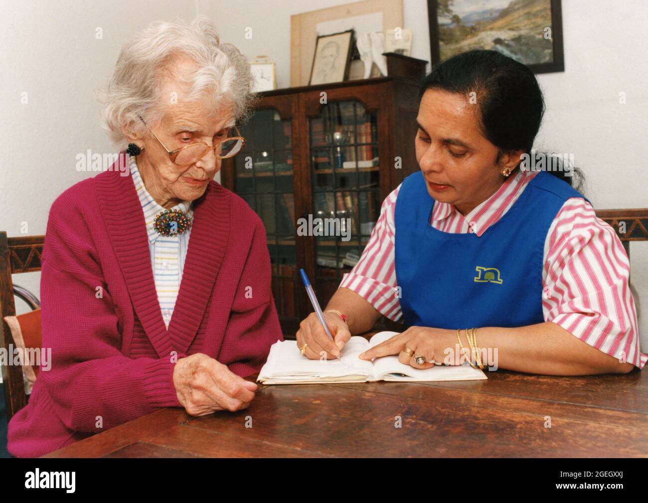 Carer and elderly woman, UK Stock Photo
