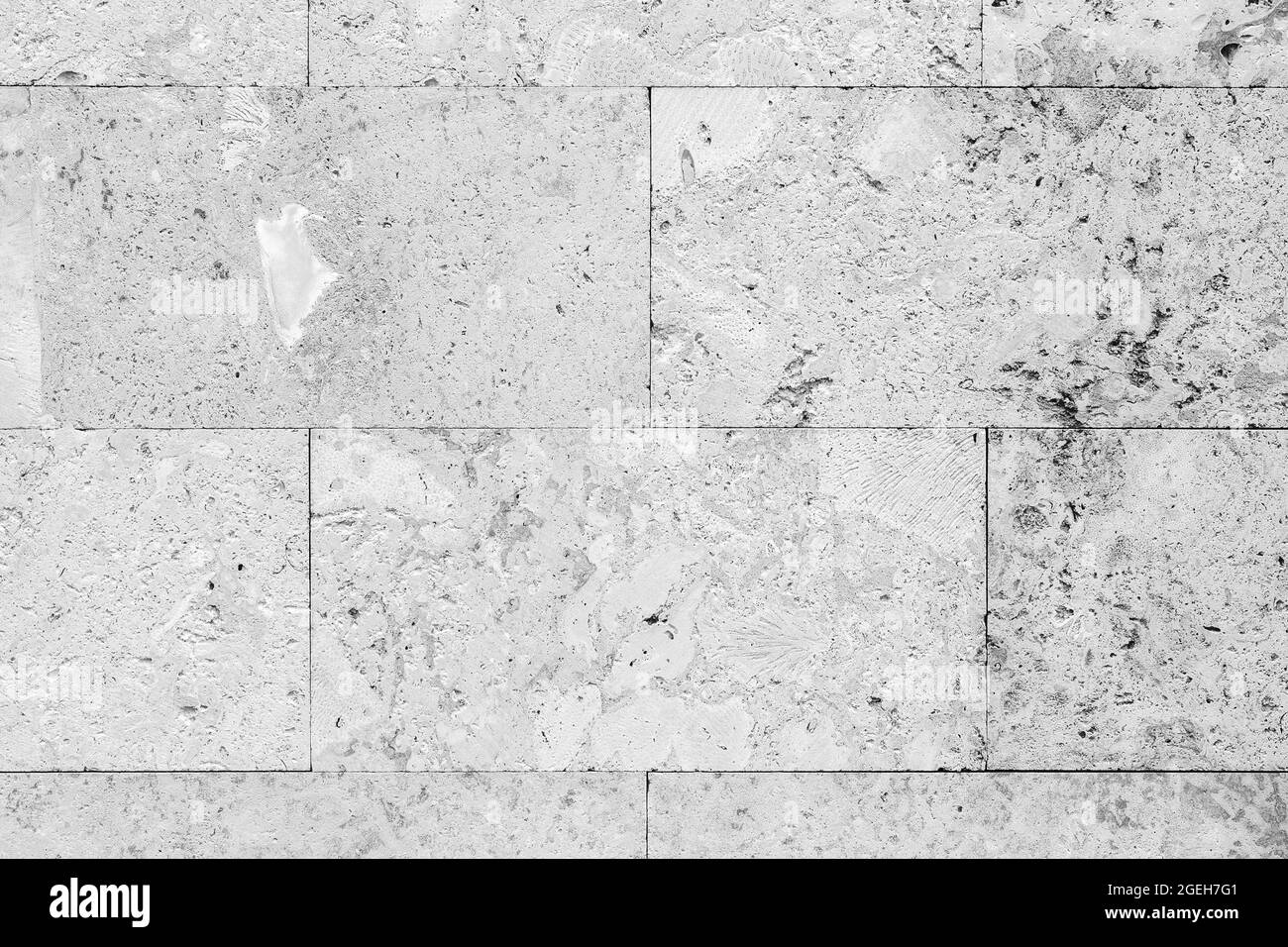 White wall with decorative stone tiling, detailed background photo