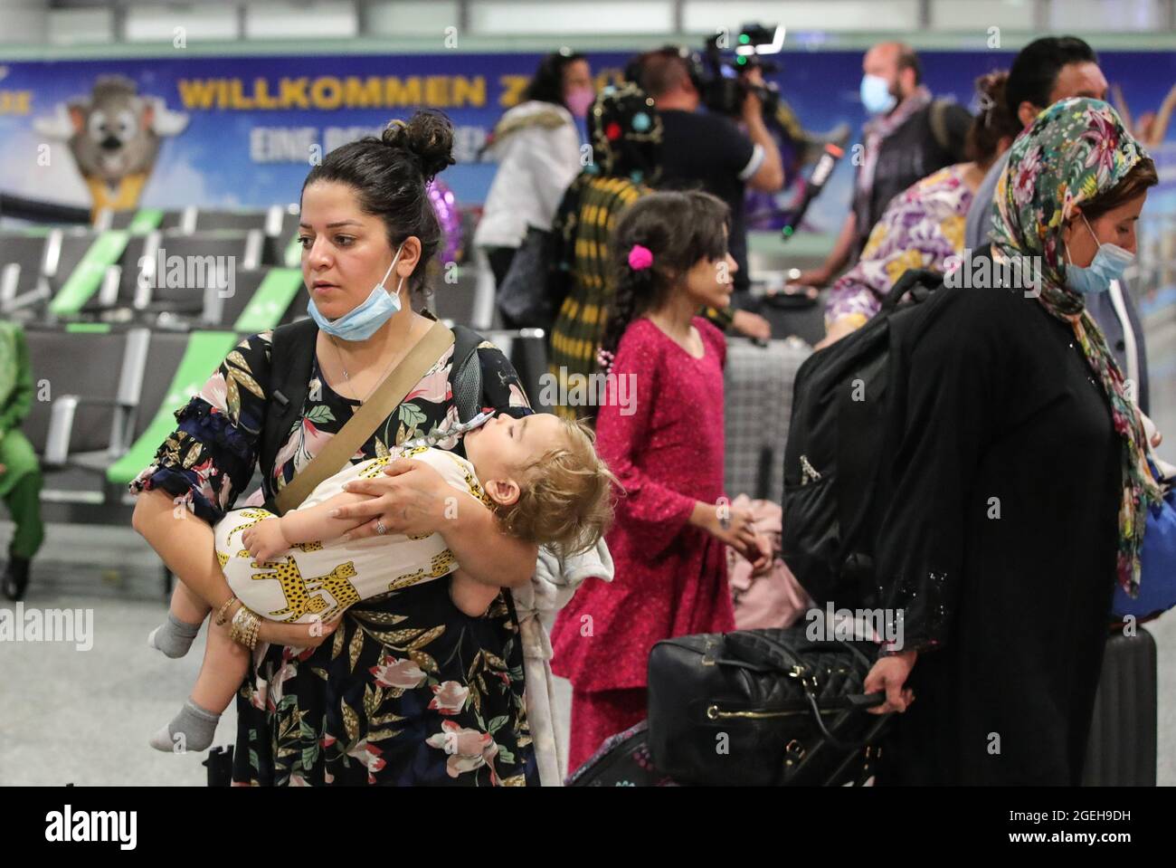 Frankfurt, Germany. 20th Aug, 2021. Passengers of a flight of Lufthansa bringing evacuees from Afghanistan arrive at Frankfurt International Airport, in Frankfurt, Germany, Aug. 20, 2021. Credit: Armando Babani/Xinhua/Alamy Live News Stock Photo