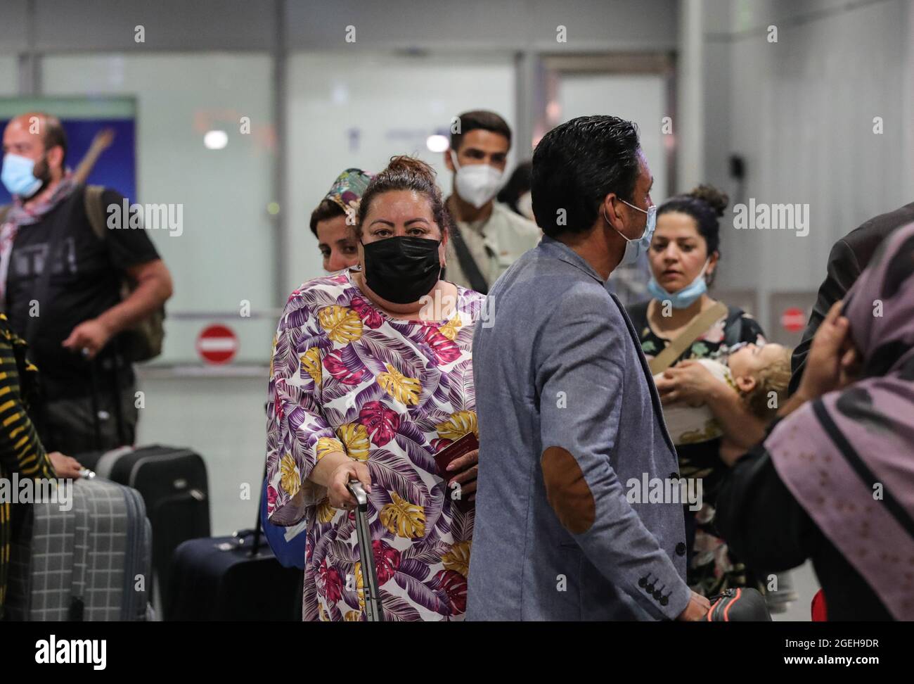 Frankfurt, Germany. 20th Aug, 2021. Passengers of a flight of Lufthansa bringing evacuees from Afghanistan arrive at Frankfurt International Airport, in Frankfurt, Germany, Aug. 20, 2021. Credit: Armando Babani/Xinhua/Alamy Live News Stock Photo
