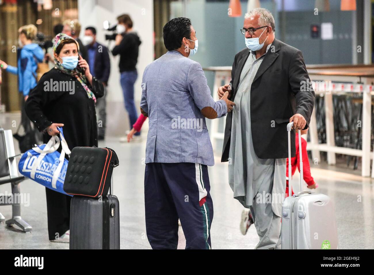Frankfurt, Germany. 20th Aug, 2021. Passengers of a flight of Lufthansa bringing evacuees from Afghanistan arrive at Frankfurt International Airport, in Frankfurt, Germany, Aug. 20, 2021. Credit: Armando Babani/Xinhua/Alamy Live News Stock Photo