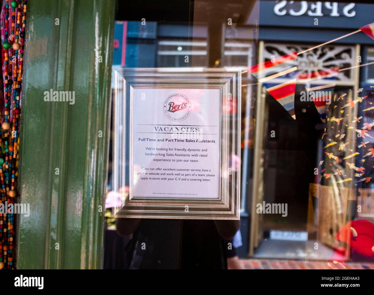 Brighton, UK. 20th Aug, 2021. Staff Wanted signs as Brighton shops and restaurants are busy during the summer holidays in Britain . Some businesses in the UK have been struggling to find enough staff since the lockdown restrictions have been eased : Credit Simon Dack/Alamy Live News Stock Photo