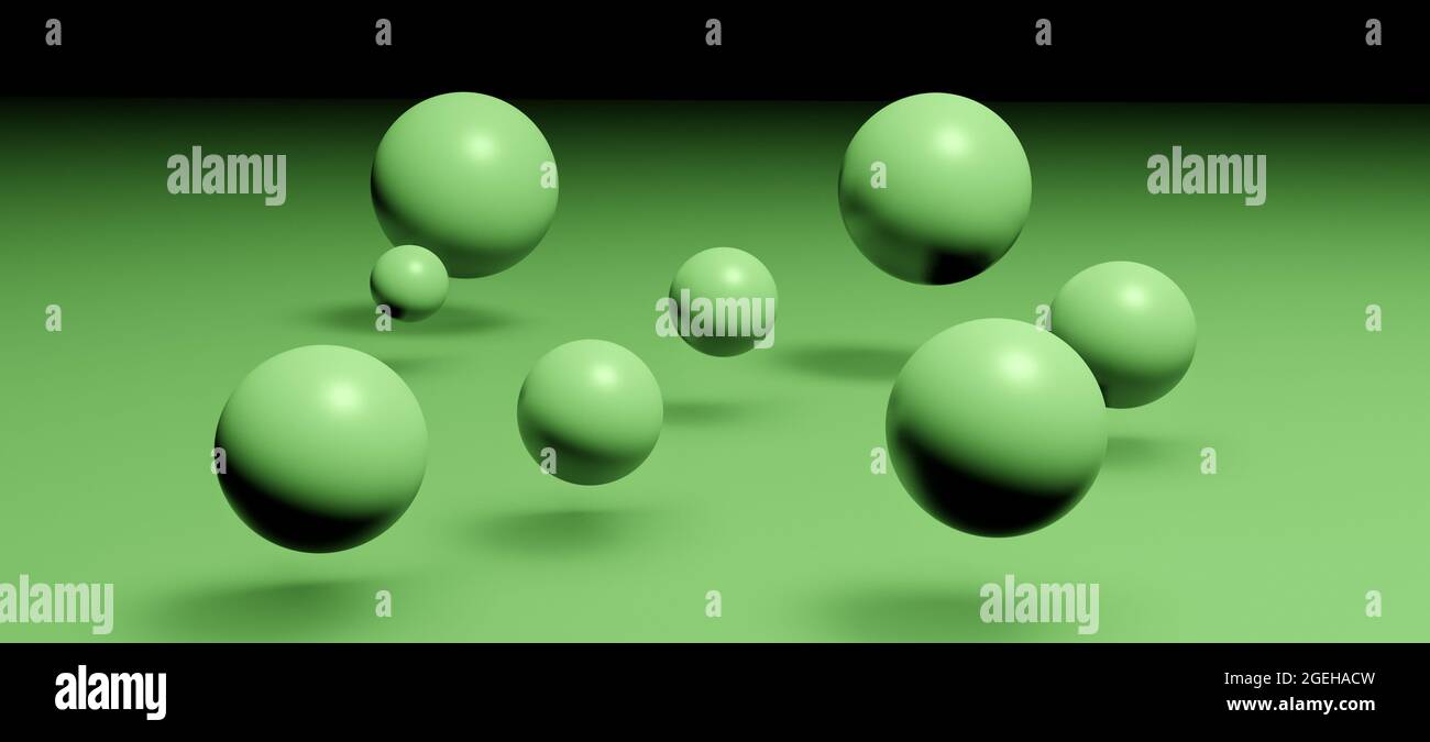 Floating 3D spheres or balls above ground on green background Stock Photo
