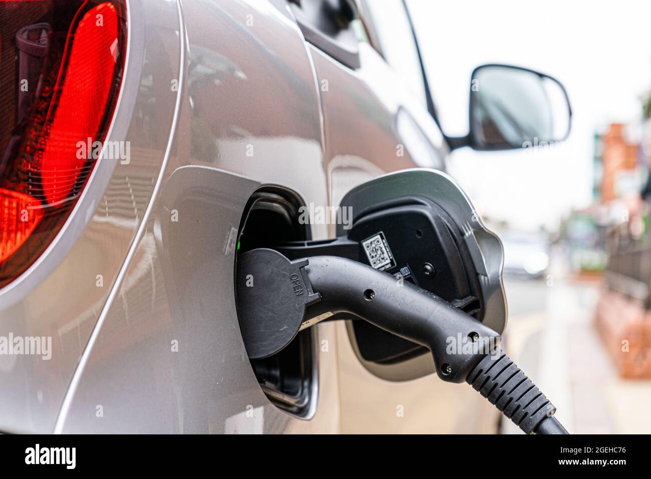Electric car charging Stock Photo - Alamy