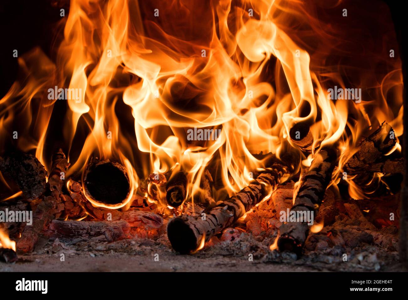 Fire and flame produced by burning wood inside an oven Stock Photo Alamy