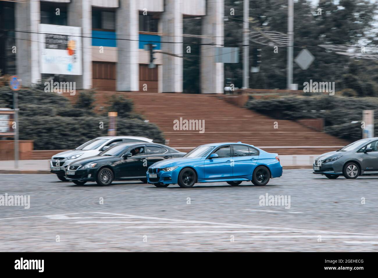 Ukraine, Kyiv 2 June 2021 Light Blue BMW 3 series car moving on the