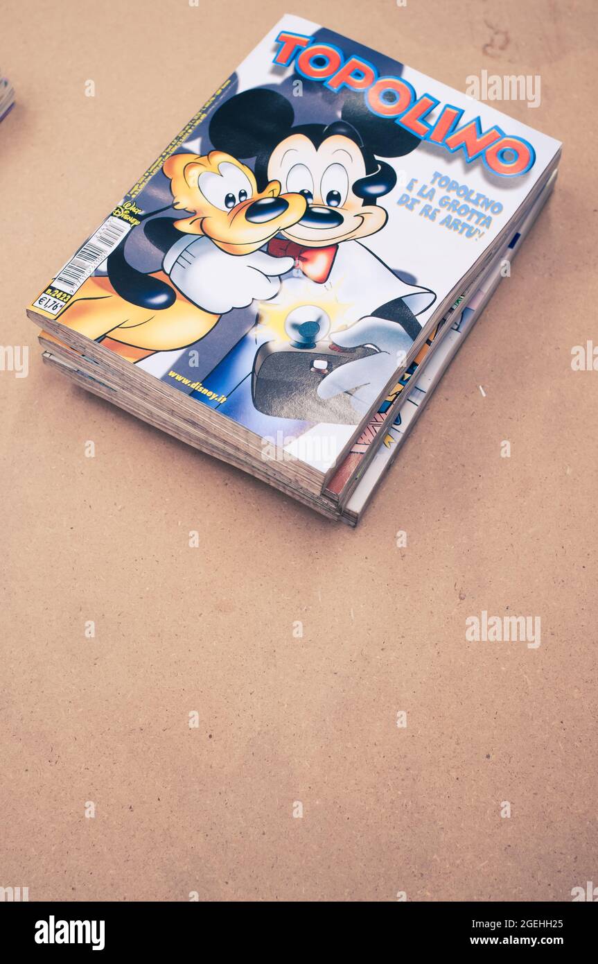 COMO, ITALY - Aug 06, 2021: A vertical shot of vintage Walt Disney comics with cartoon characters on the cover, Italian edition with free space for te Stock Photo