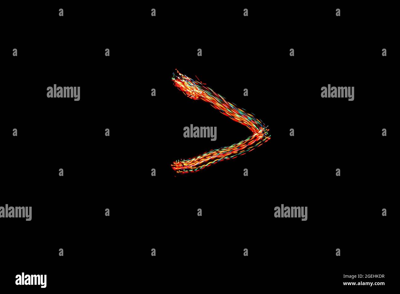 'Greater than' sign. Light painting math signs. Long exposure
