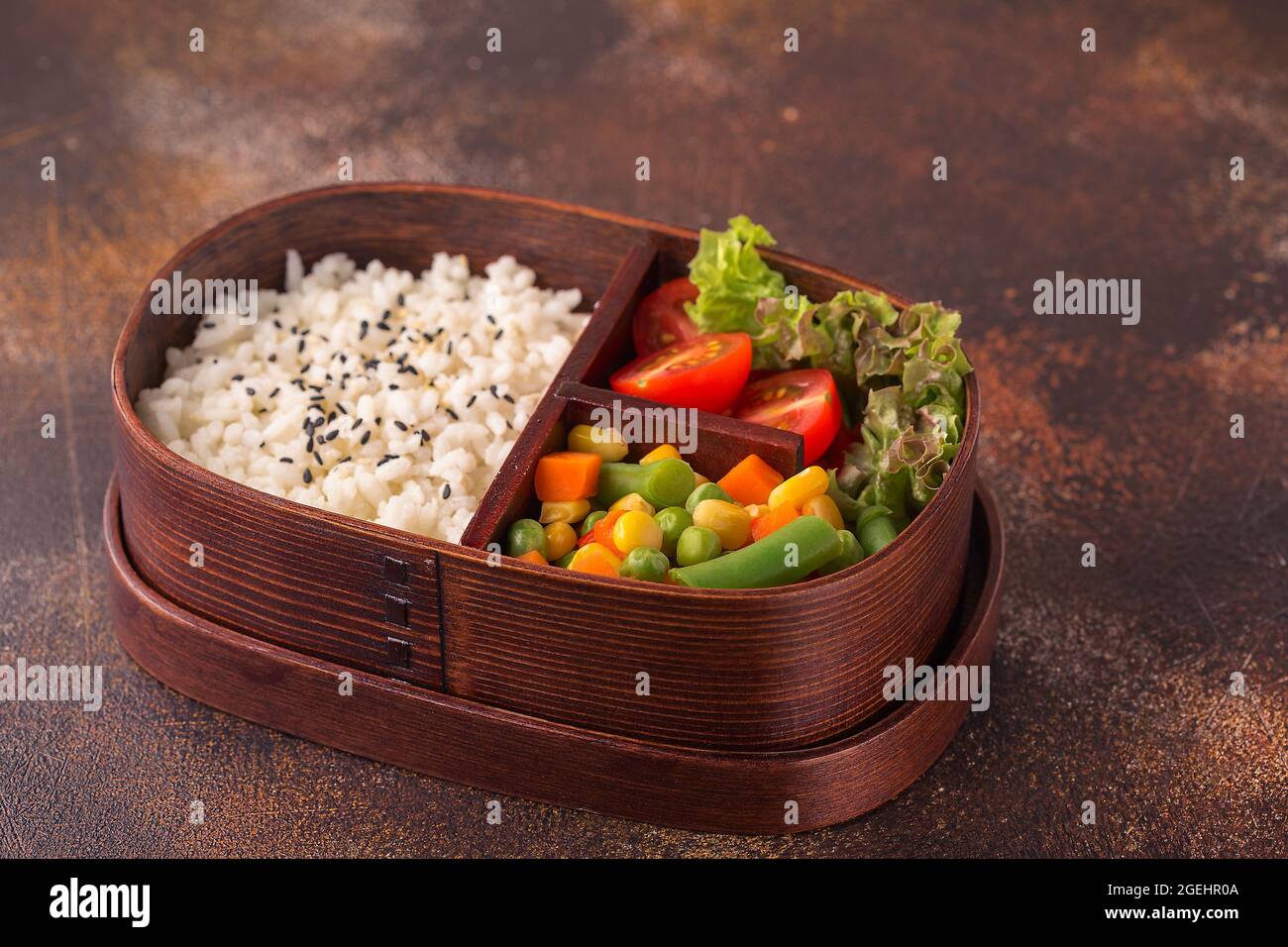 Healthy lunch in wooden japanese bento box. Balanced healthy food