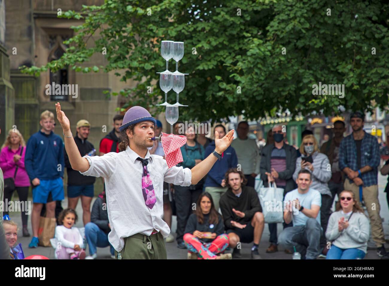 Edinburgh, Scotland, UK weather. 20 August 2021. Cloudy day for city centre and those seeking some enterainment from the various festivals in the city. Pictured: Timon street performer with his balancing act. Credit: Arch White/Alamy Live News Stock Photo
