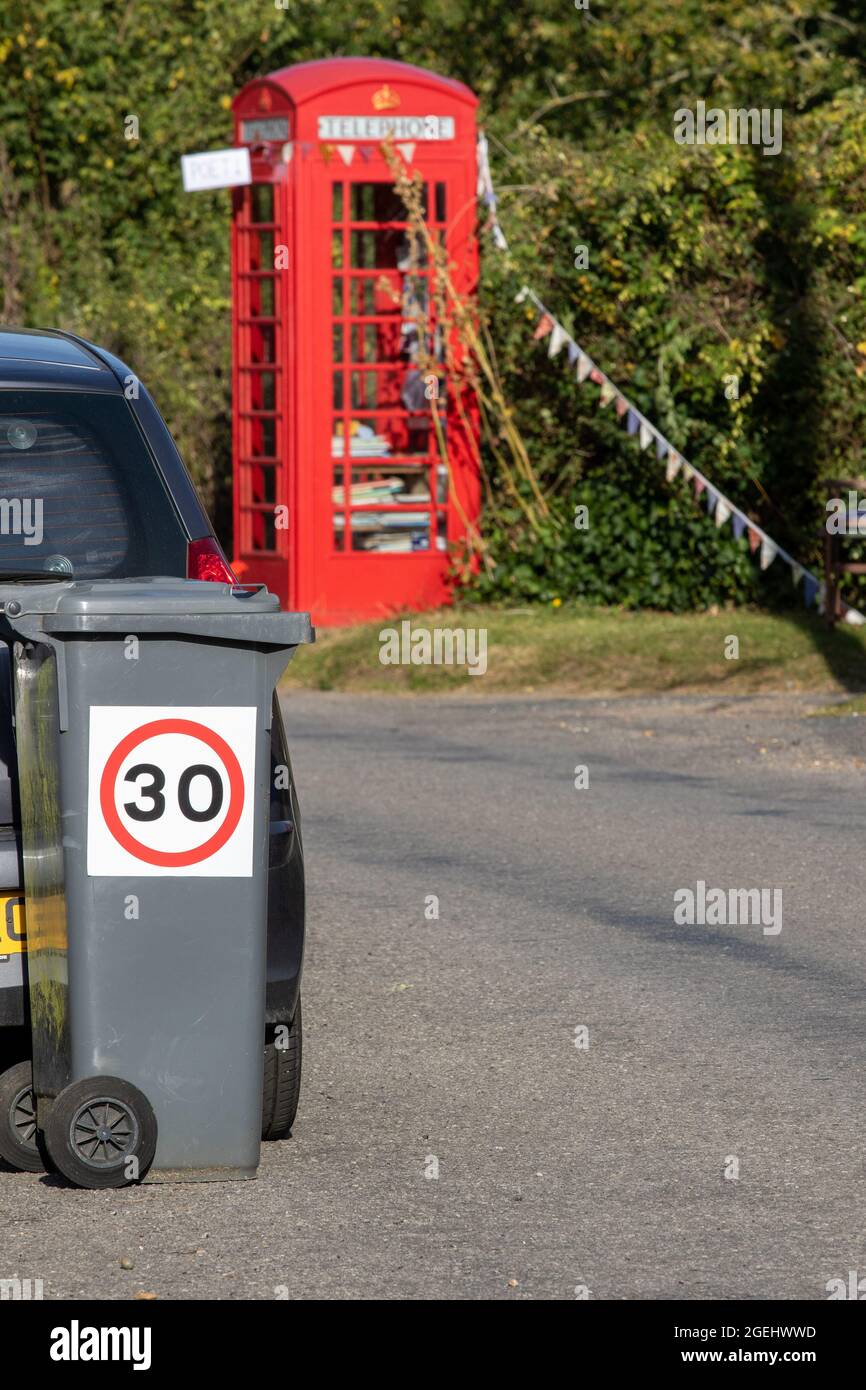 Informal speed limit reminder on a wheelie bin to remind drivers Stock Photo