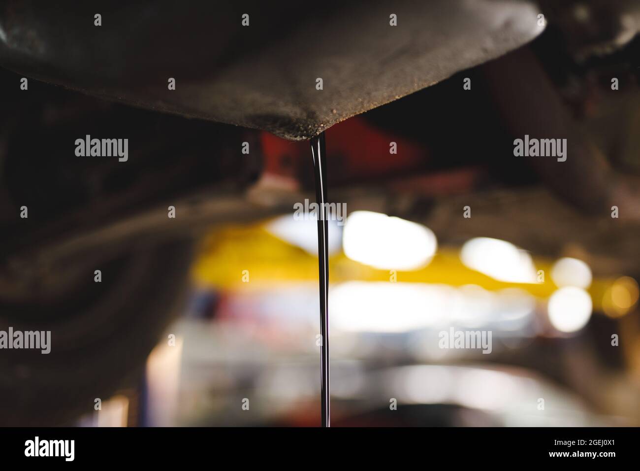 Close up of oil pouring out of car Stock Photo Alamy