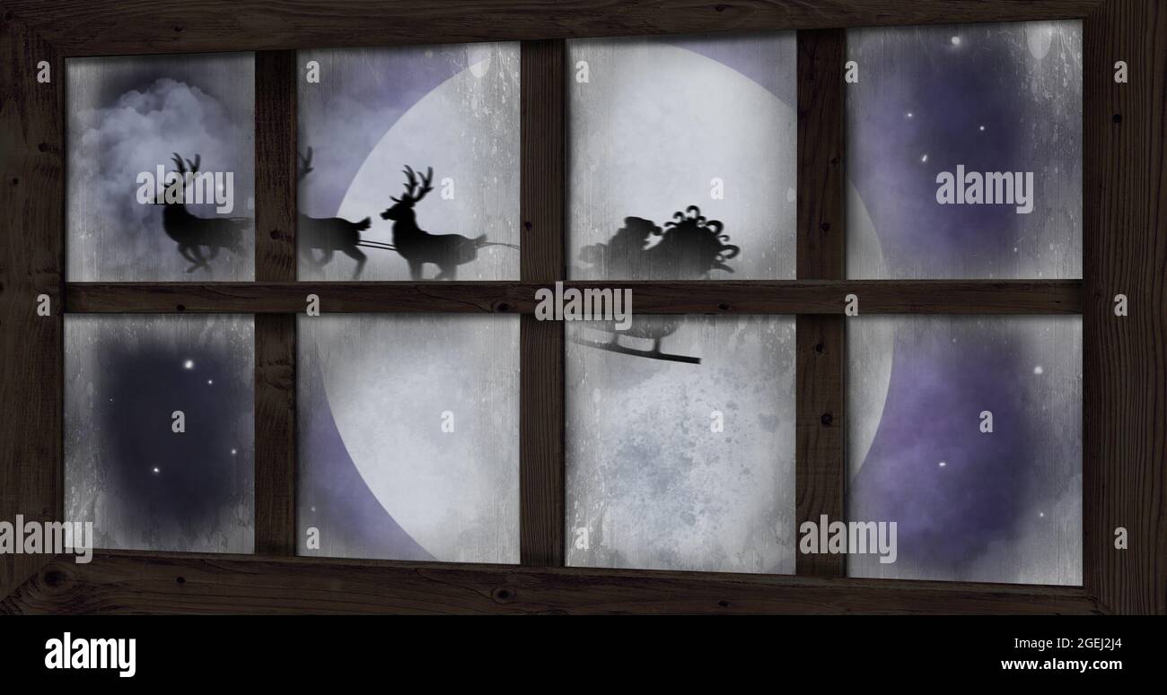 Image of silhouette of santa claus in sleigh being pulled by reindeer ...