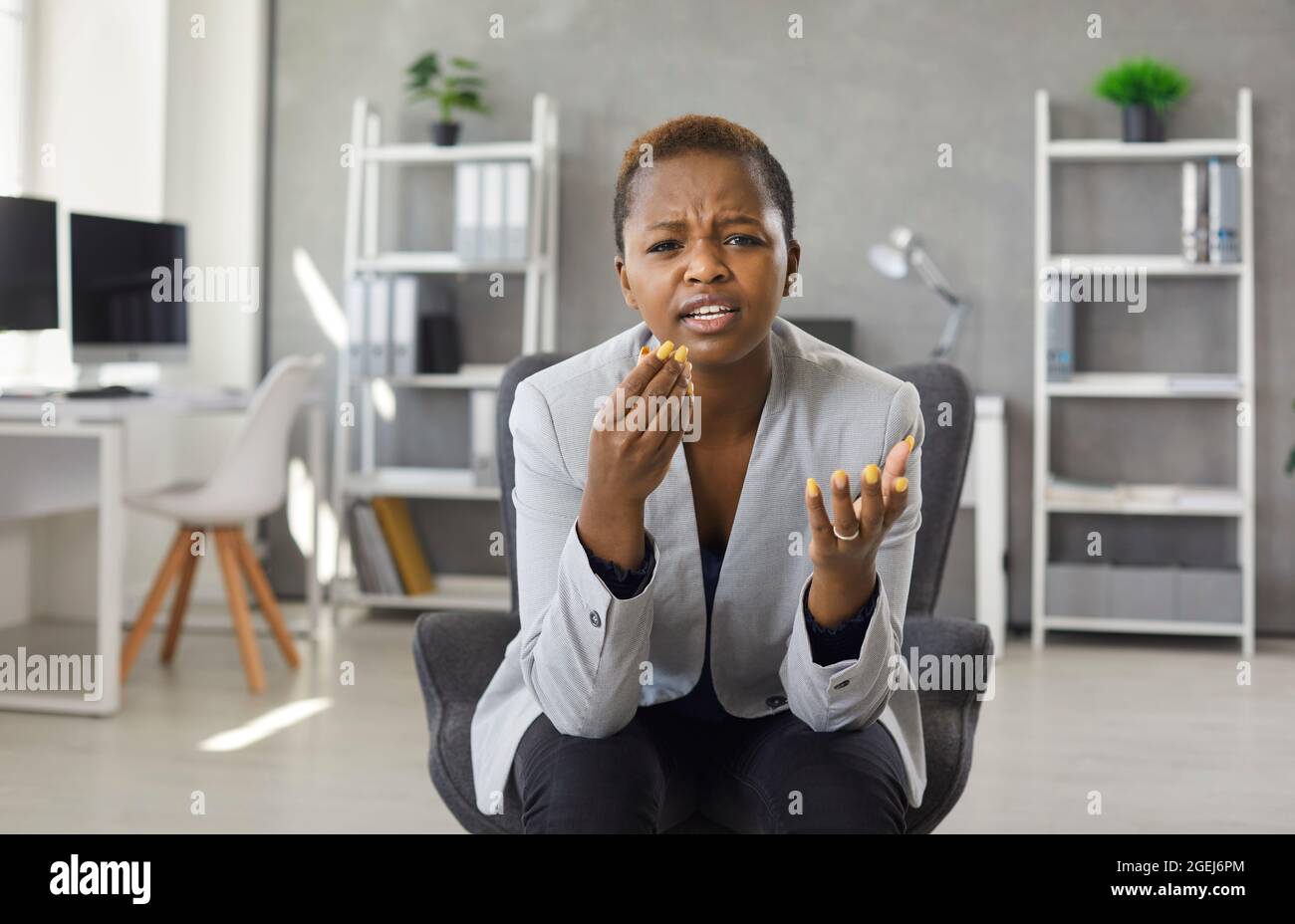 Woman gets all confused and can't understand anything while having a conversation Stock Photo
