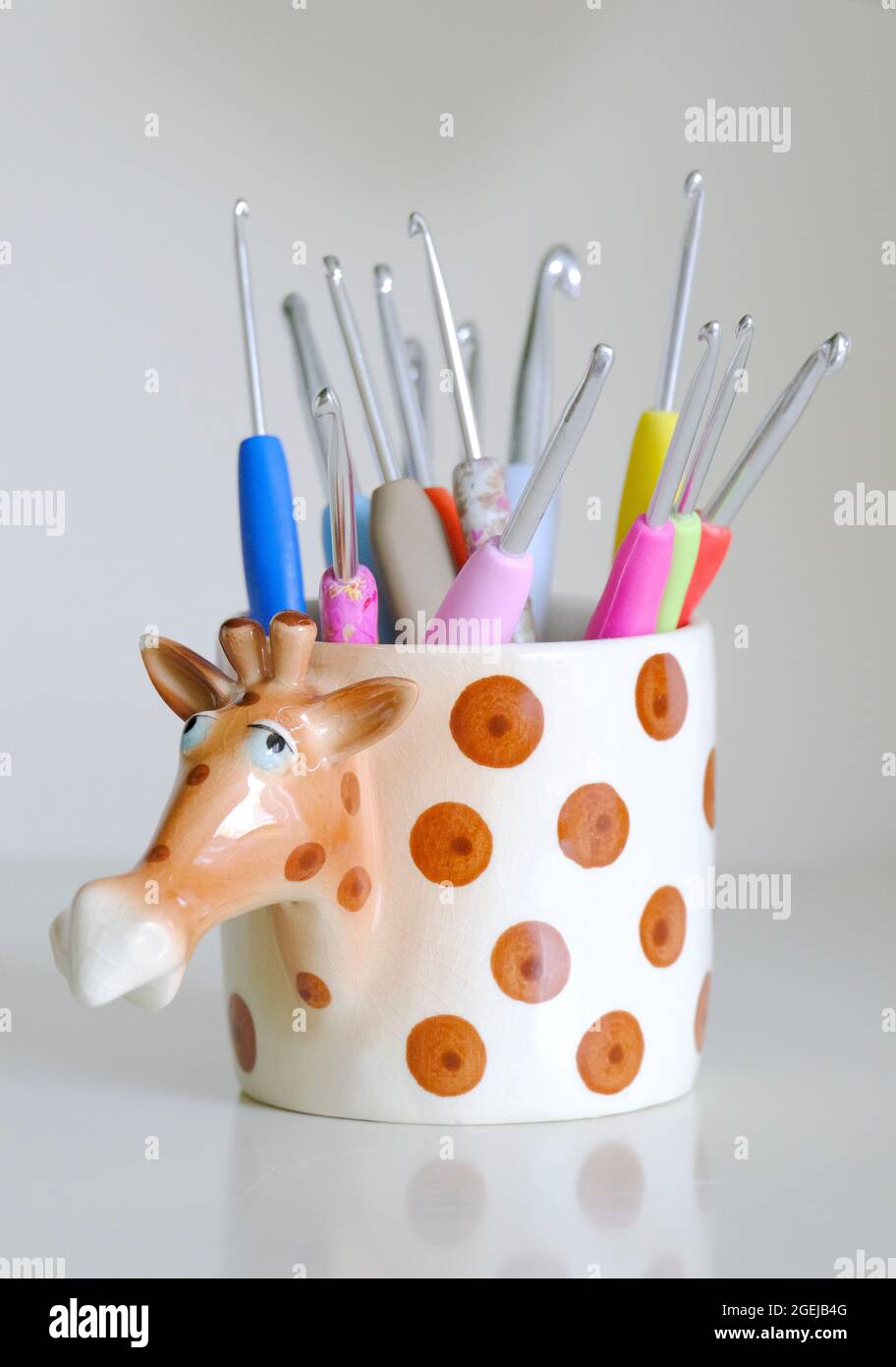 Novelty crochet hook container in the shape of a giraffe Stock Photo