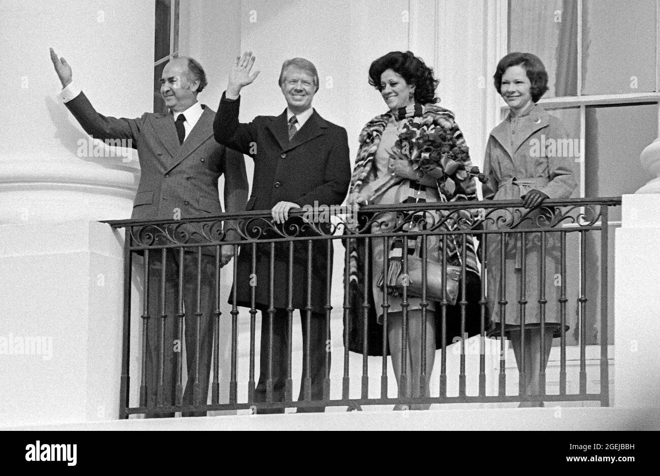 From left to right: President José López Portillo of Mexico, United States President Jimmy Carter, Carmen Romano de López Portillo, and first lady Rosalynn Carter wave to their guests from the Blue Room Balcony following a State Arrival Ceremony at the White House in Washington, DC on  Monday, February 14, 1977.Credit: Benjamin E. 'Gene' Forte / CNP /MediaPunch Stock Photo