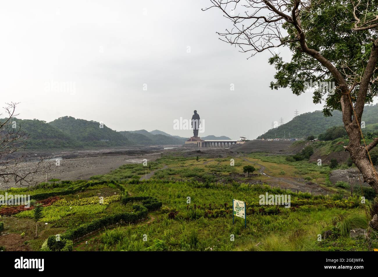 Statue of Unity as seen from Valley of Flowers on a cloudy day at