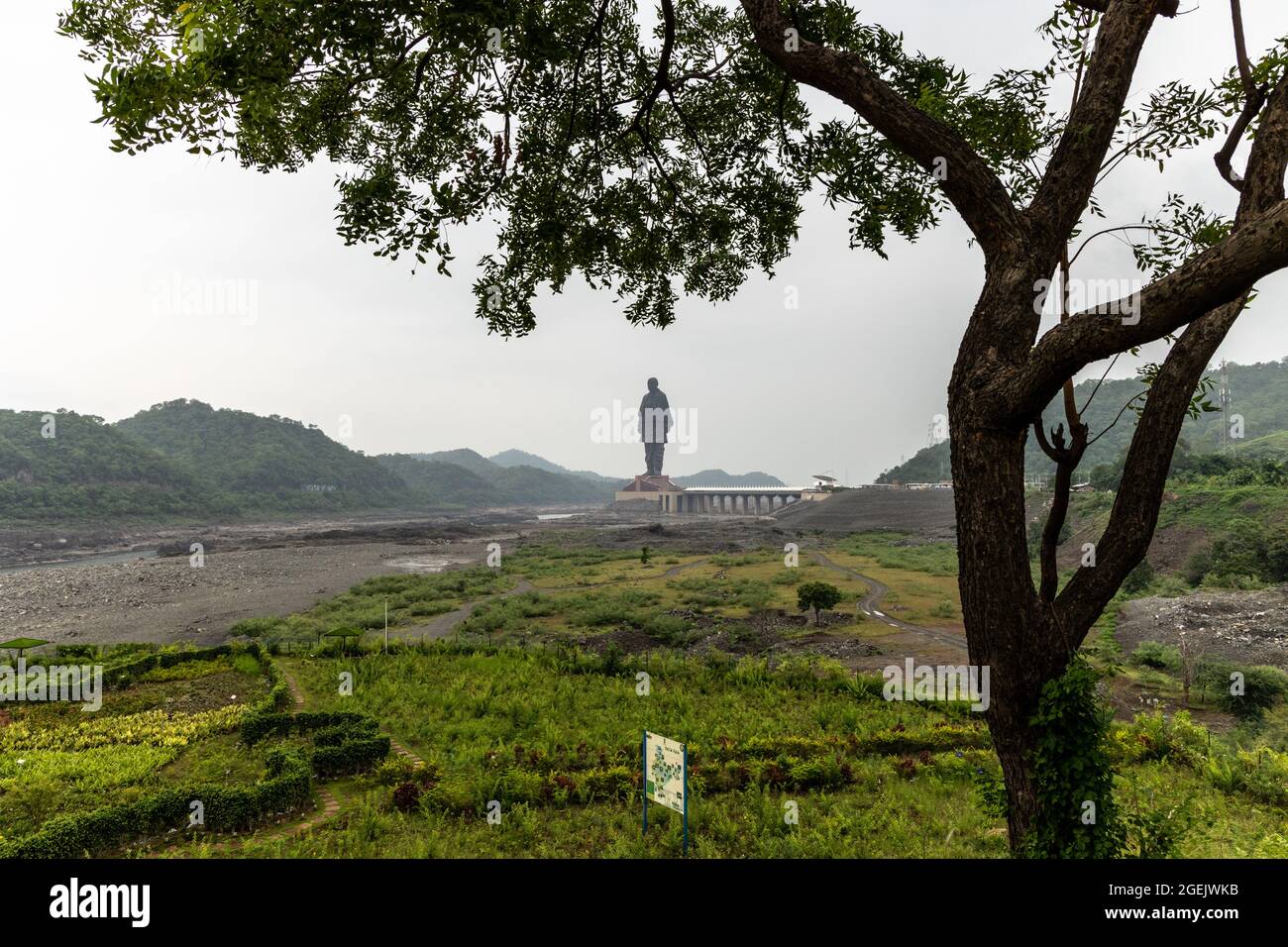 Statue of Unity as seen from Valley of Flowers on a cloudy day at