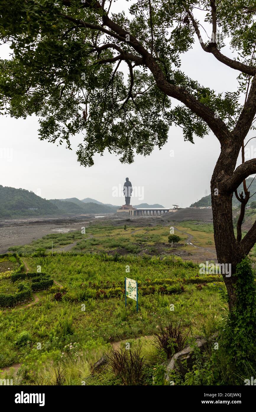 Statue of Unity as seen from Valley of Flowers on a cloudy day at