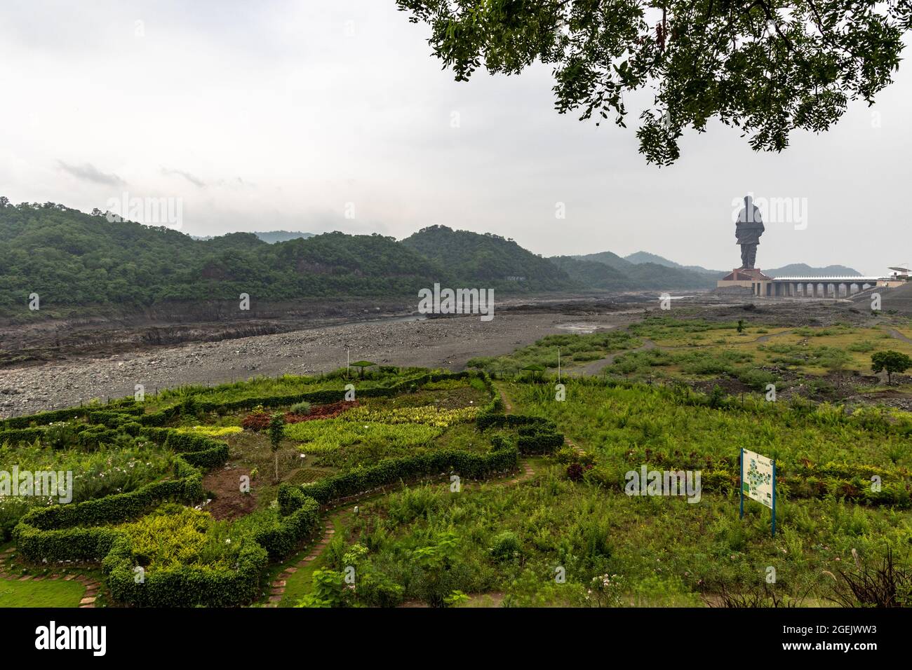 Statue of Unity as seen from Valley of Flowers on a cloudy day at