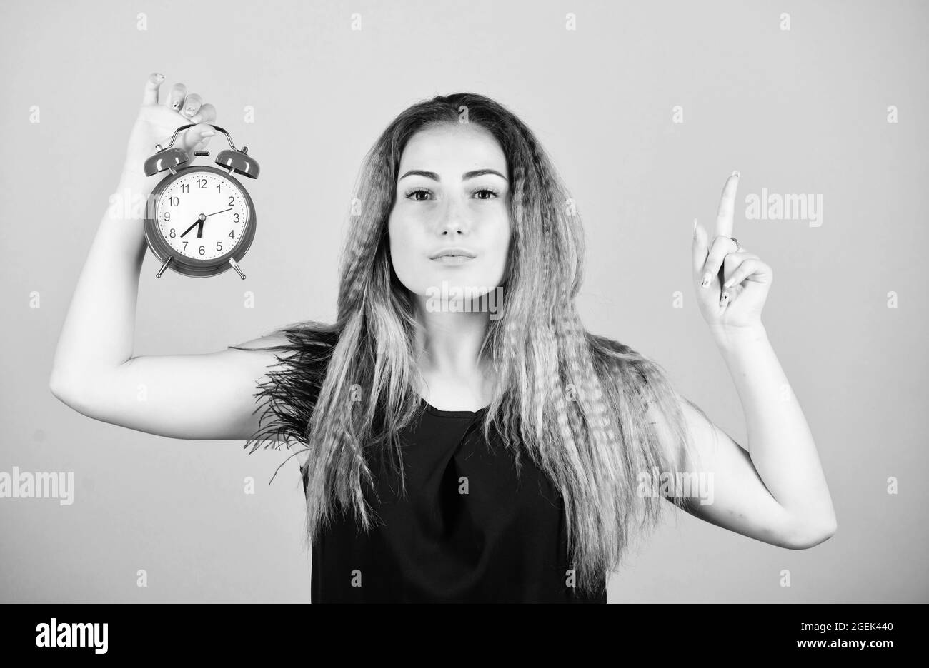 Time management. Woman hold vintage alarm clock. Watch repair