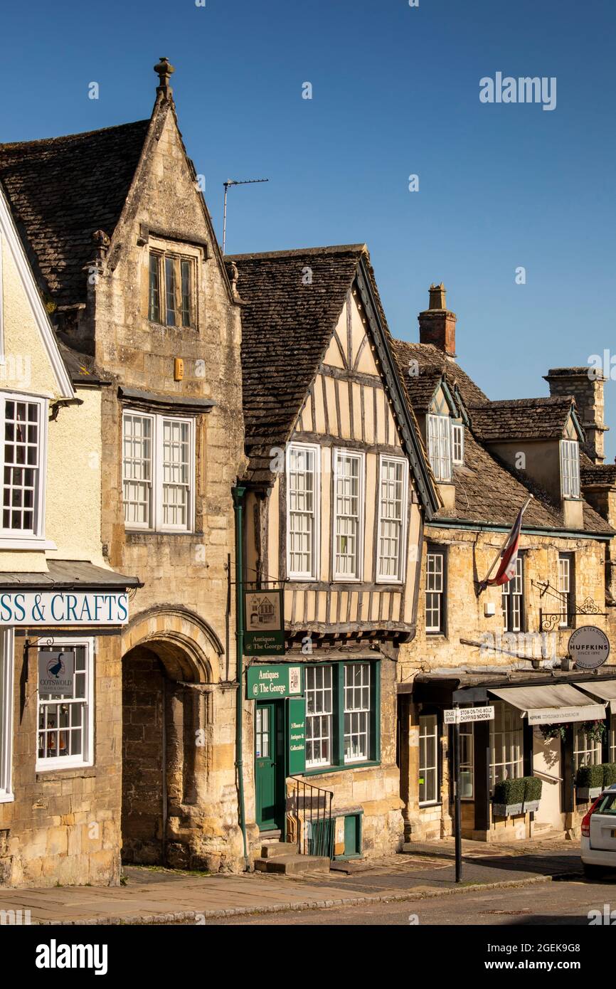 UK, England, Oxfordshire, Burford, High Street, stone arch to George Yard and half-timbered former George Inn Stock Photo